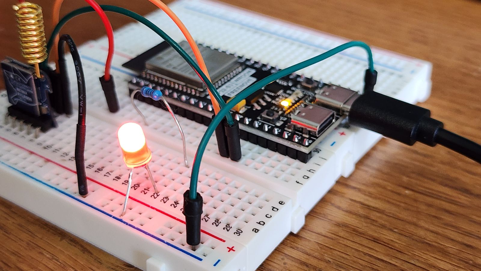 ESP32 microcontroller and LED on a breadboard