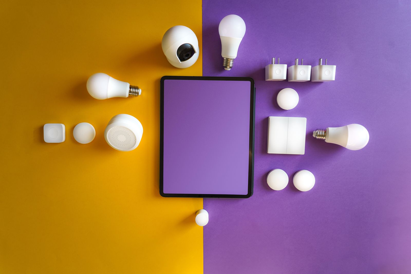 A collection of smart home devices laid out on a table