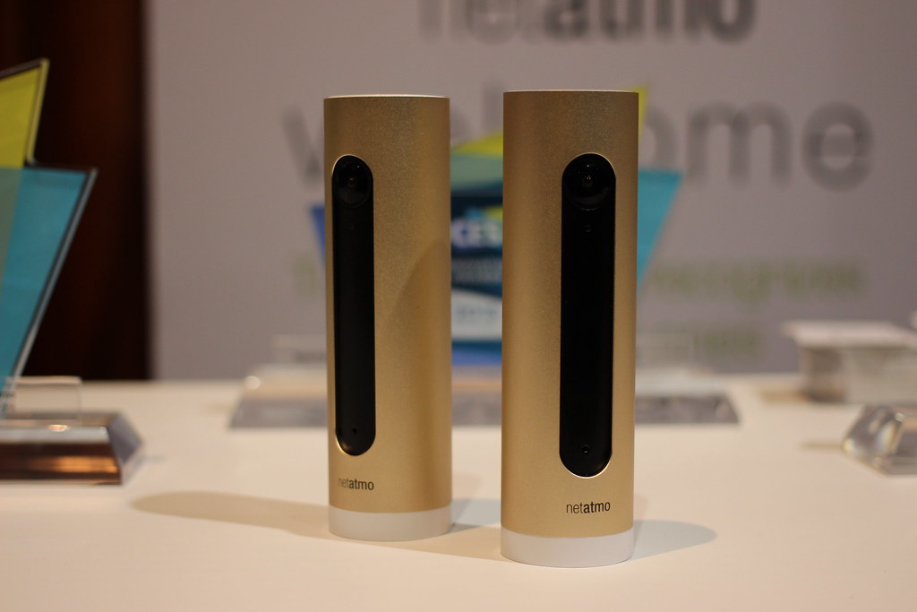 A Netatmo smart home camera on a shelf