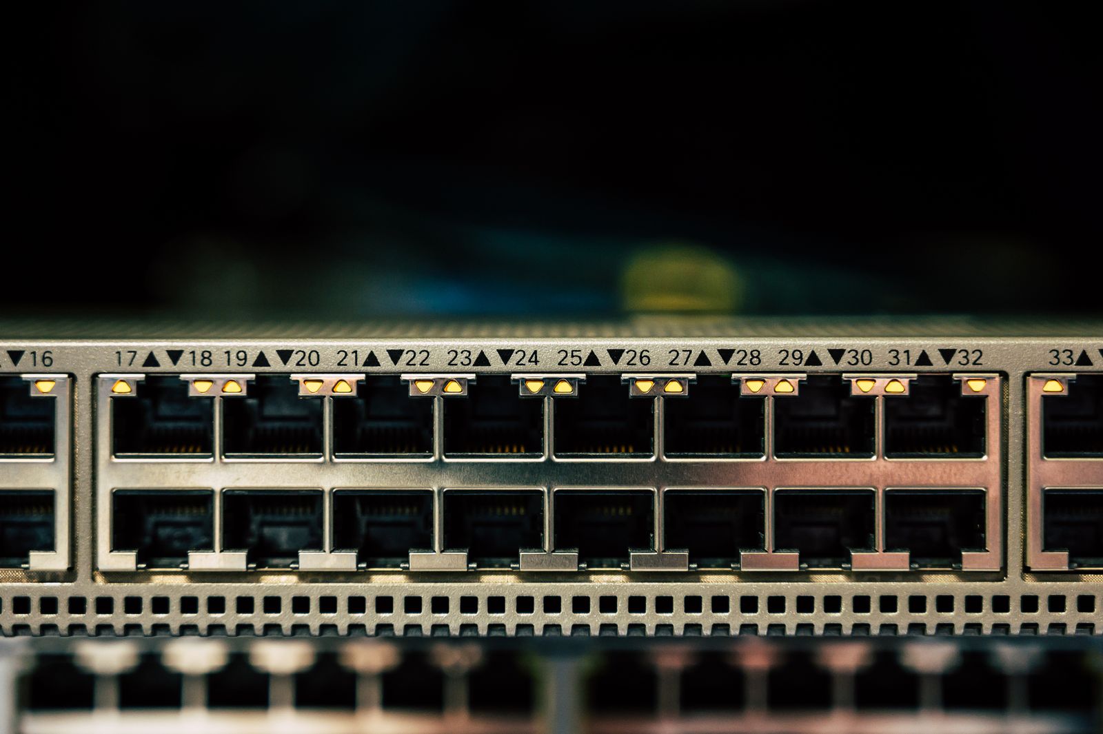 Close-up of a network switch with multiple Ethernet ports and status LEDs
