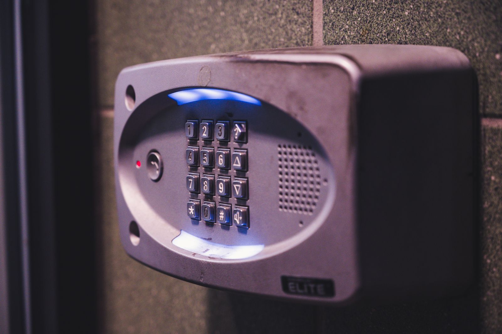 Illuminated security keypad mounted on a wall